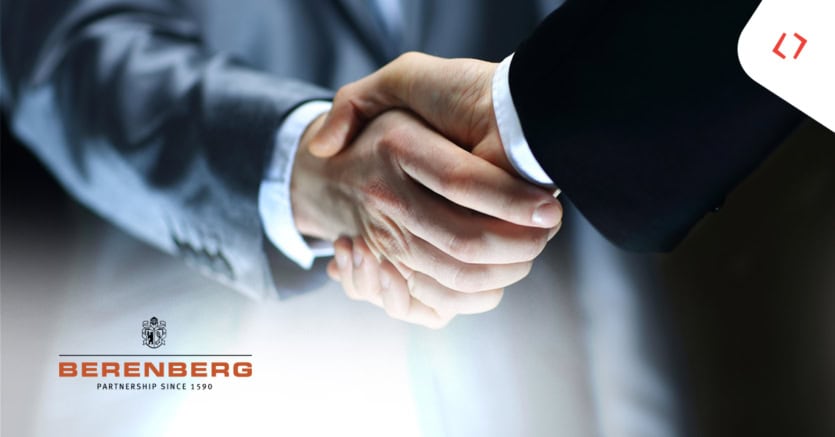 Two people in business attire shaking hands, with the Berenberg logo —highlighting a strong tech partnership between Berenberg and Profinit.