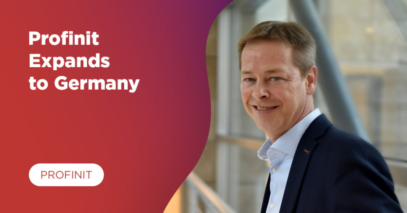 Rainer Vorwerk, Head of DE at Profinit, stands indoors by a window. Text on the left reads: Profinit launches a new entity in Germany, with the Profinit logo below.